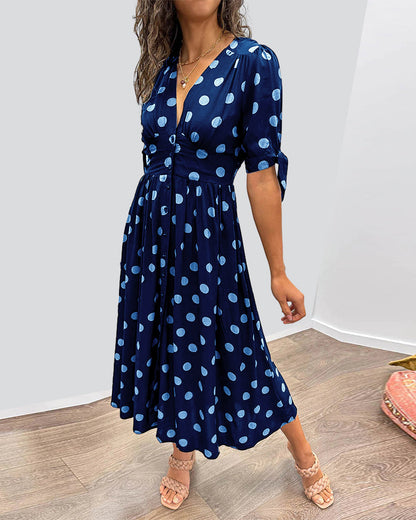 Caterina – Robe midi à pois col V effet sculptant