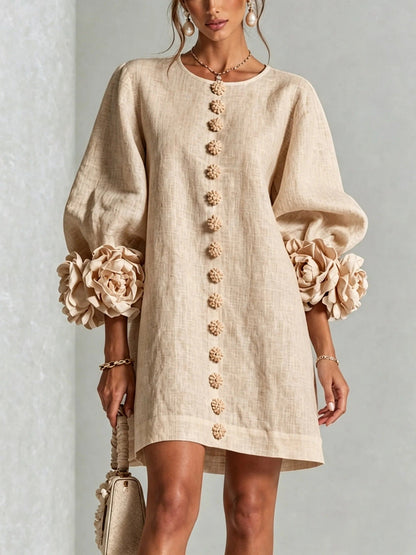 Robe à fleurs avec manches volumineuses et décolleté rond