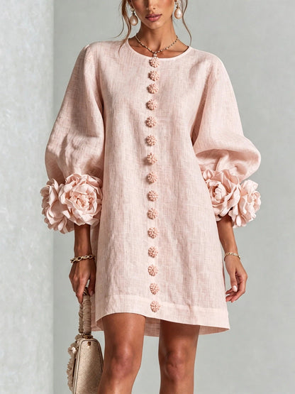 Robe à fleurs avec manches volumineuses et décolleté rond