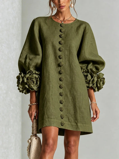 Robe à fleurs avec manches volumineuses et décolleté rond