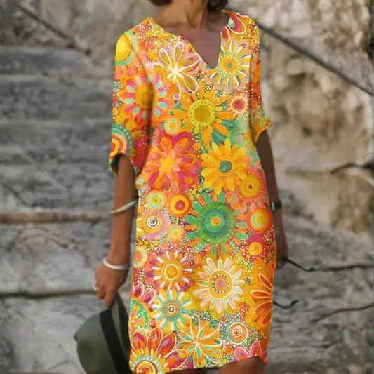Nira – Robe midi fluide fleurie et élégante