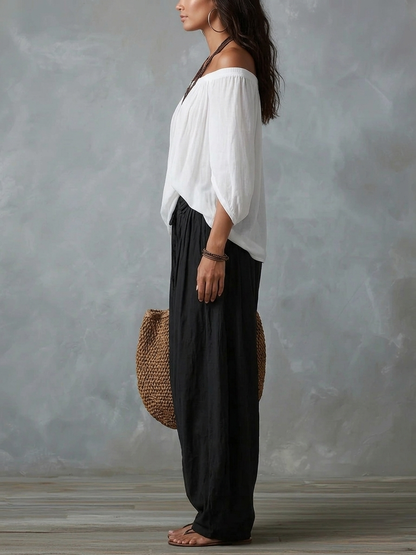Ensemble haut blanc à épaules dénudées et pantalon évasé style lanterne