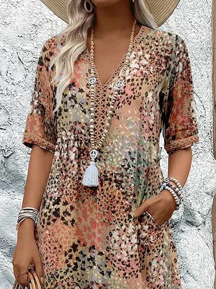 Véronique – Robe midi fluide élégante