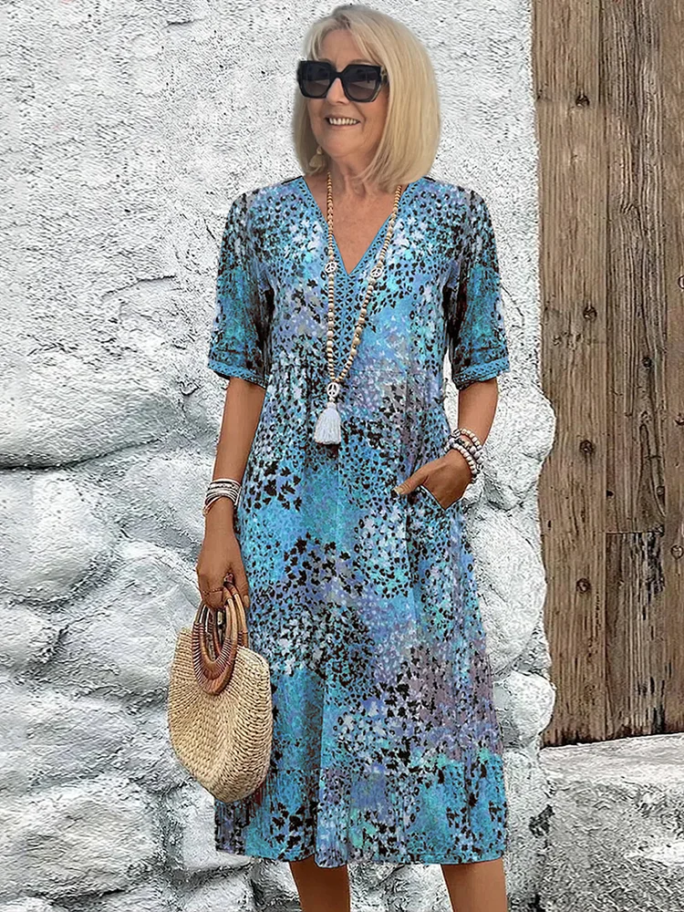 Véronique – Robe midi fluide élégante