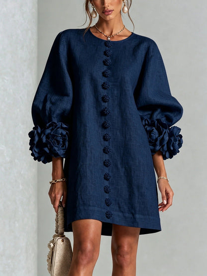 Robe à fleurs avec manches volumineuses et décolleté rond
